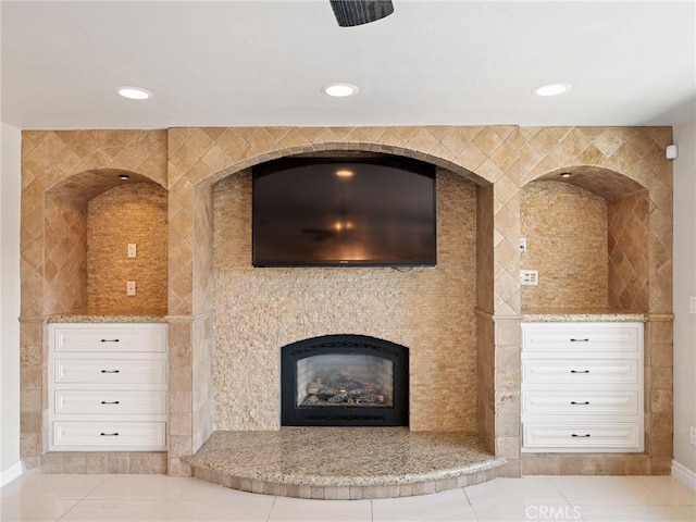 details featuring recessed lighting and a fireplace