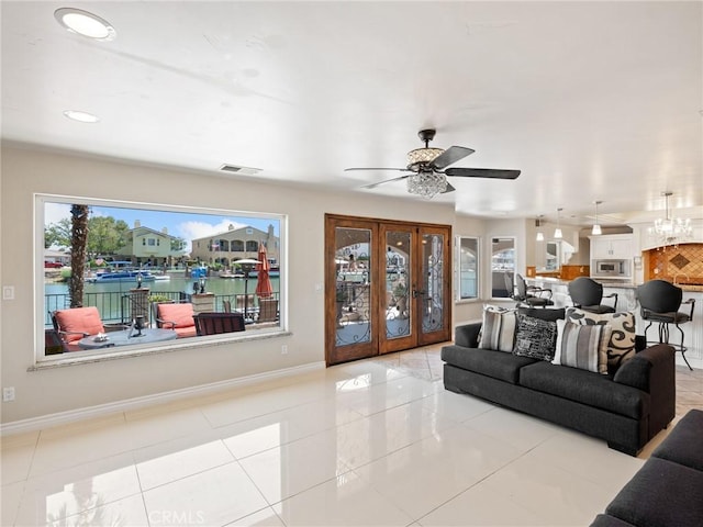 tiled living room with recessed lighting, visible vents, baseboards, and ceiling fan