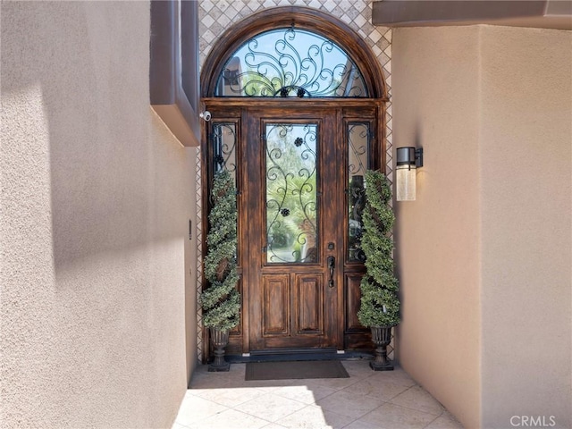 doorway to property with stucco siding