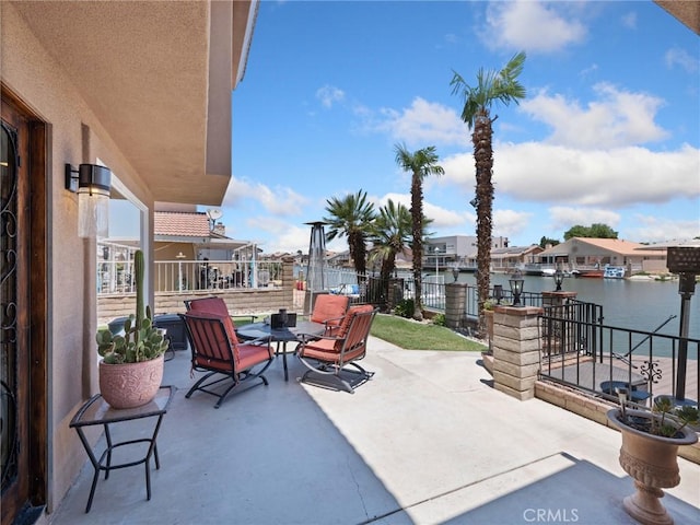 view of patio / terrace featuring a water view