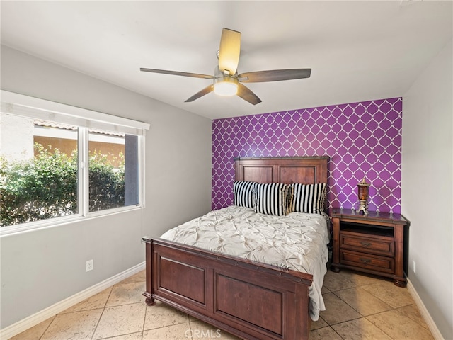 bedroom featuring ceiling fan and light tile patterned flooring