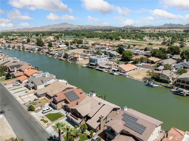 bird's eye view with a residential view and a water and mountain view