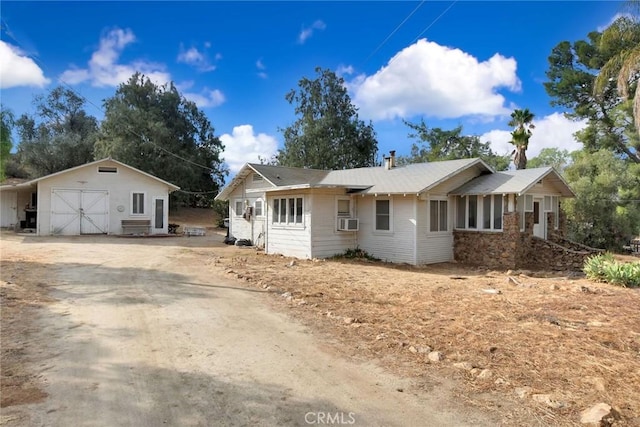 single story home featuring cooling unit