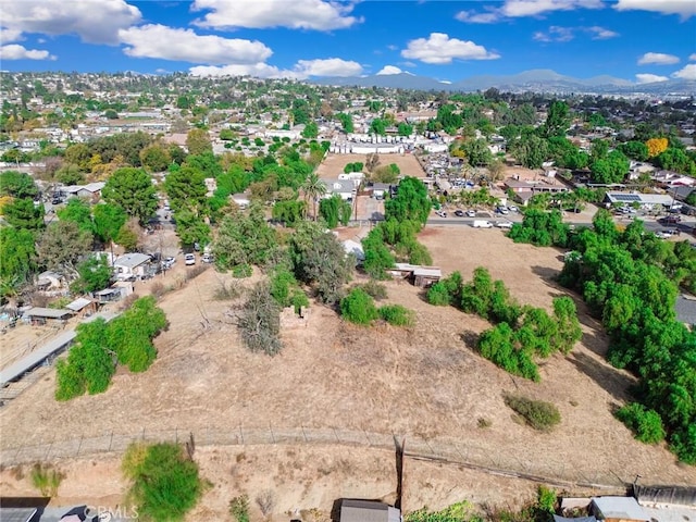 birds eye view of property with a mountain view