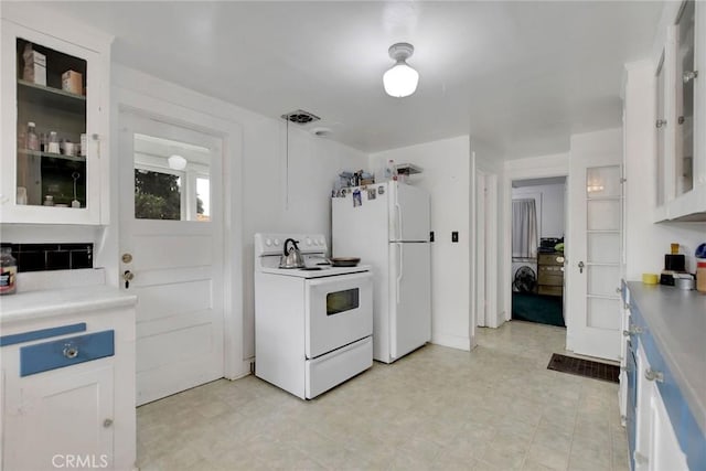 kitchen with pendant lighting, white cabinetry, and white appliances