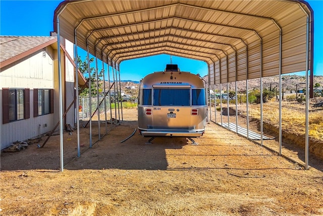 view of vehicle parking featuring a carport