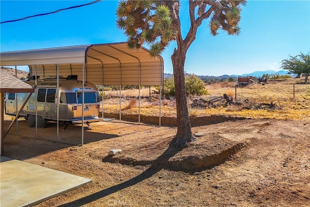 view of yard with a carport