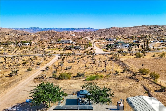 birds eye view of property featuring a mountain view