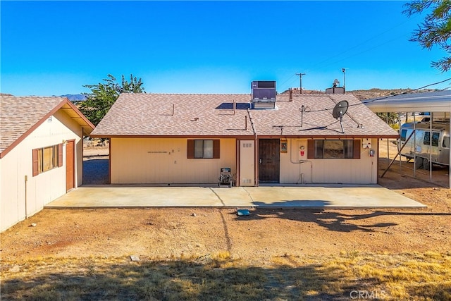 back of house with a patio and central AC