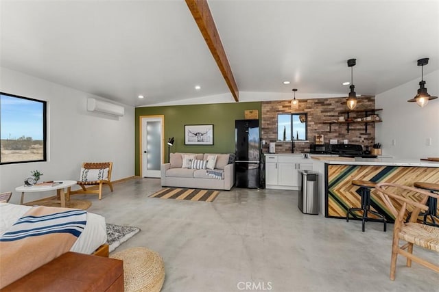 65154 Hoover Rd, Joshua Tree, CA 92252 - living area with a wall mounted AC, finished concrete floors, and recessed lighting