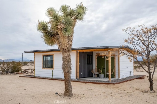 back of property featuring a patio