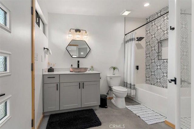 full bathroom featuring vanity, shower / bath combination with curtain, concrete floors, and a wealth of natural light