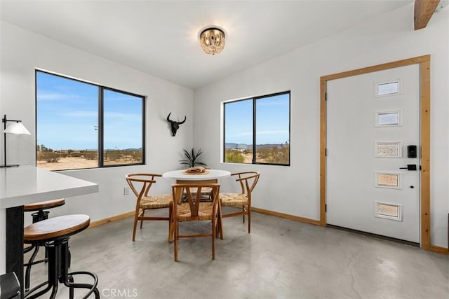 dining room with concrete flooring