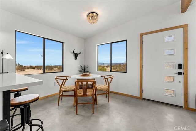 65154 Hoover Rd, Joshua Tree, CA 92252 - dining space with baseboards and concrete floors