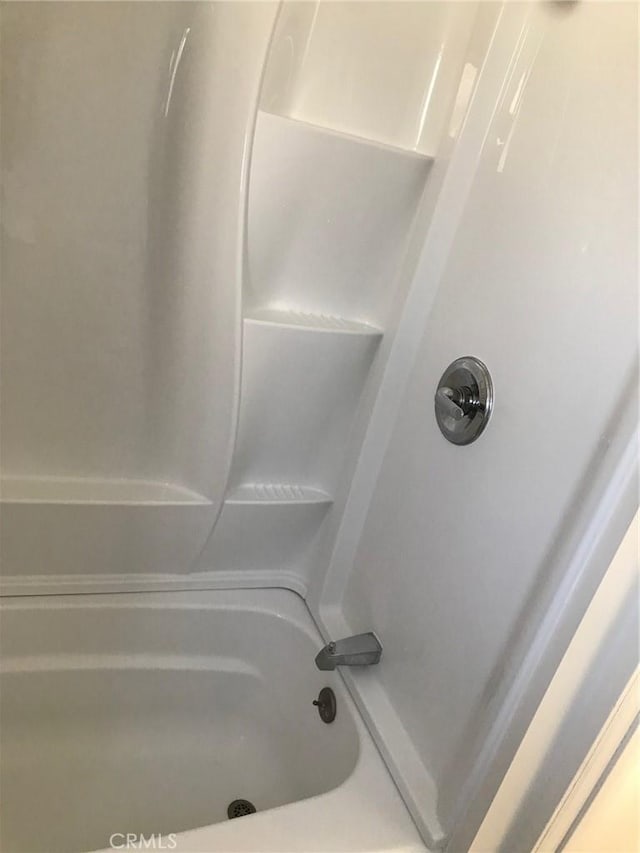 bathroom featuring washtub / shower combination