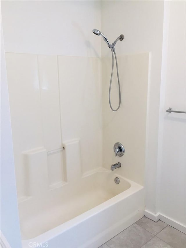 bathroom with tile patterned flooring and tub / shower combination