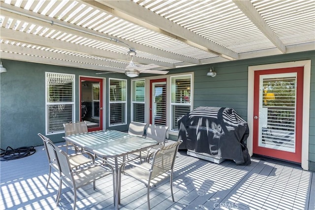 wooden deck featuring a pergola and a grill