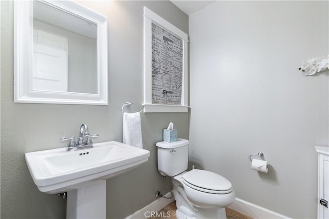 bathroom with toilet and sink