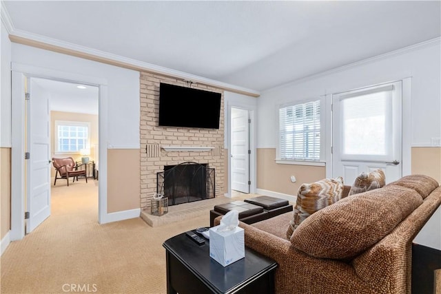 living room featuring ornamental molding, a fireplace, and light carpet