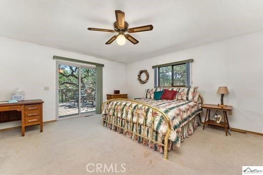 bedroom featuring access to exterior, carpet, multiple windows, and ceiling fan