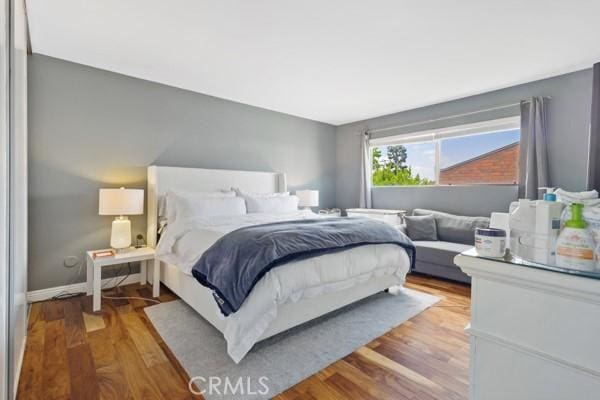 bedroom with wood-type flooring