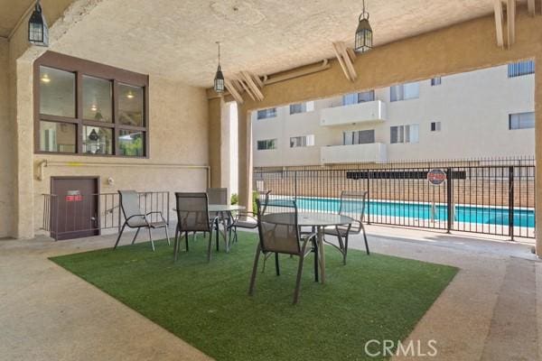 view of patio with a community pool