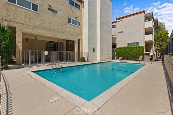 view of pool featuring a patio