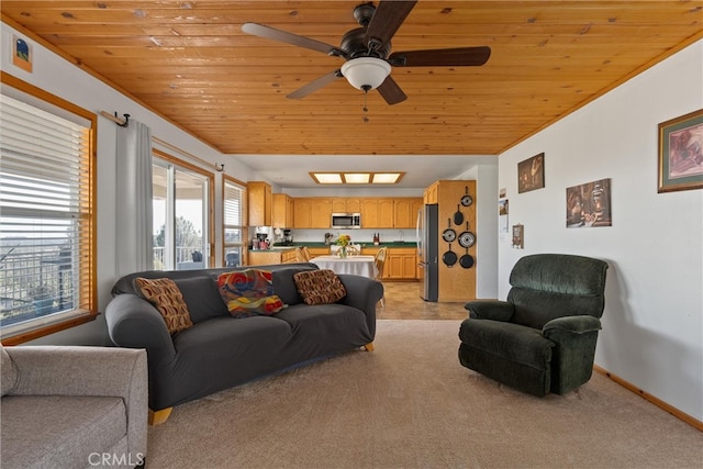 carpeted living room featuring ceiling fan and wood ceiling