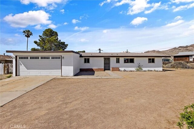 single story home featuring a garage