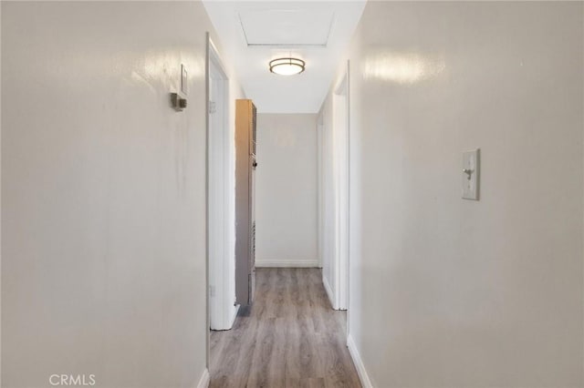 corridor with light wood-type flooring