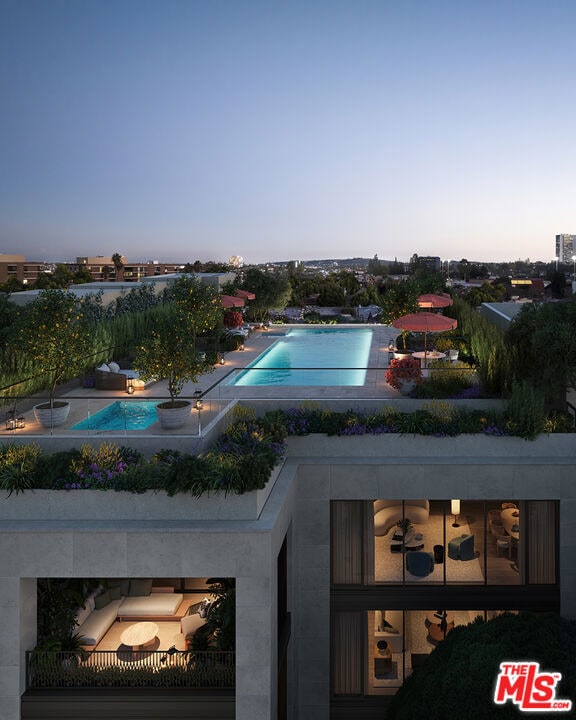 view of pool at dusk