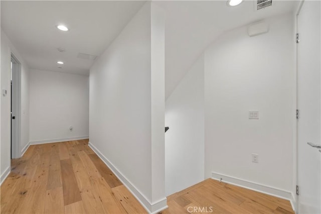 hall with hardwood / wood-style flooring