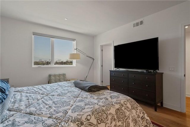 bedroom with light hardwood / wood-style floors