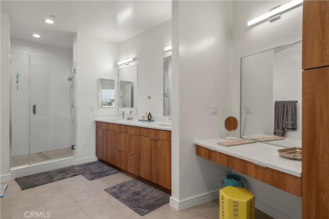 bathroom featuring tile patterned floors, vanity, and walk in shower