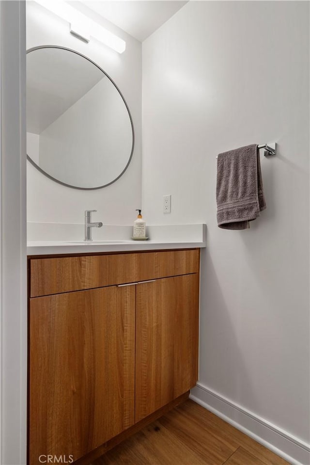 bathroom featuring vanity and hardwood / wood-style flooring