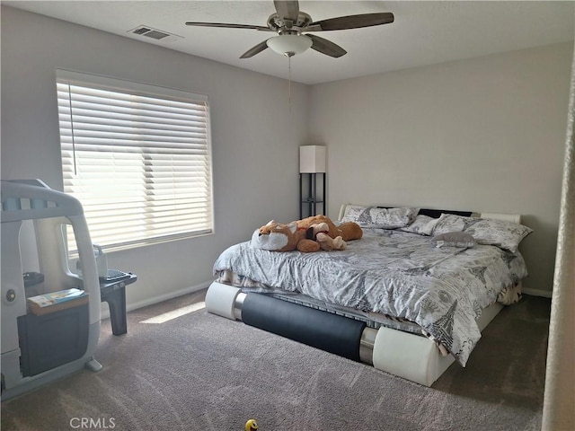 bedroom with dark carpet and ceiling fan