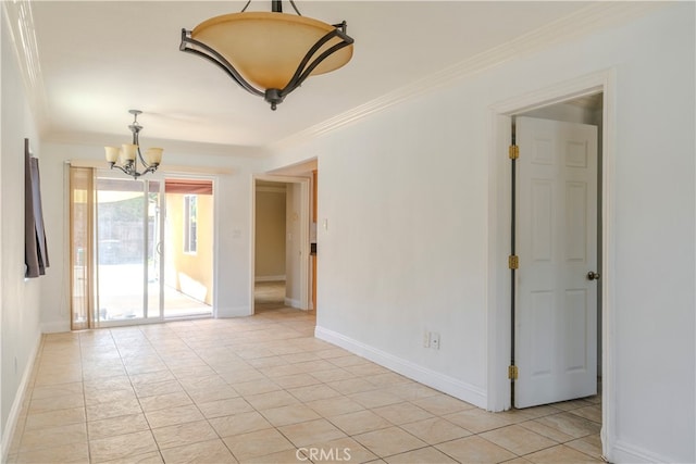 empty room featuring crown molding and an inviting chandelier