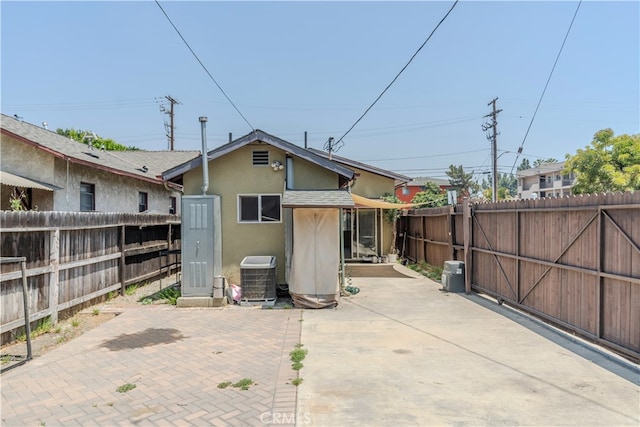 exterior space featuring cooling unit and a patio area