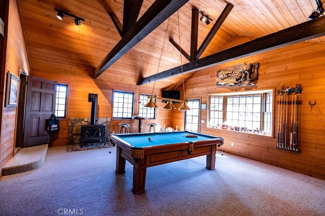 game room with a wood stove, carpet floors, and a wealth of natural light