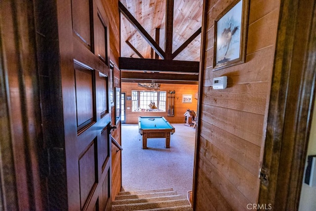 interior space featuring high vaulted ceiling, billiards, carpet floors, and wooden walls