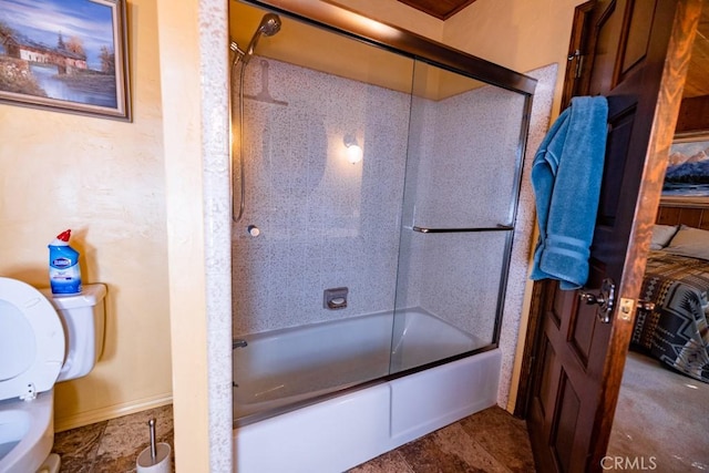 bathroom with toilet and enclosed tub / shower combo