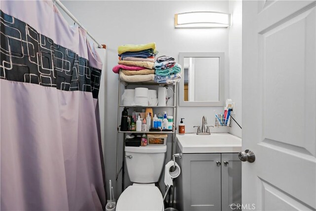 bathroom with toilet and vanity