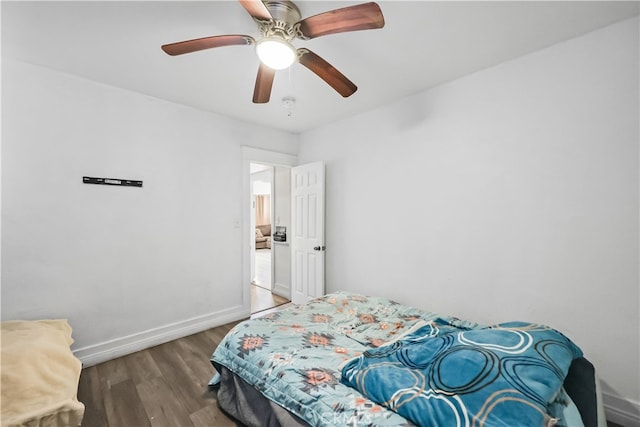 bedroom with ceiling fan and hardwood / wood-style flooring