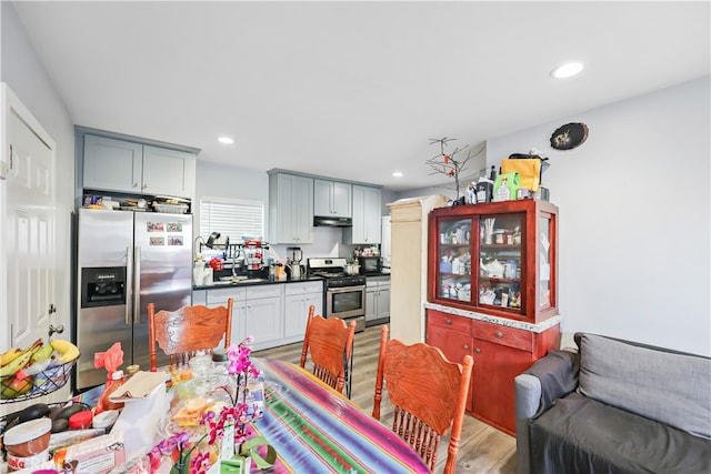 kitchen featuring light hardwood / wood-style floors, gray cabinetry, and stainless steel appliances