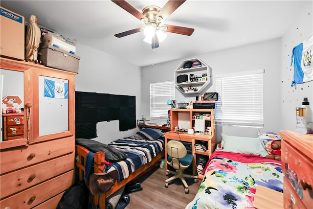 bedroom featuring ceiling fan and hardwood / wood-style flooring