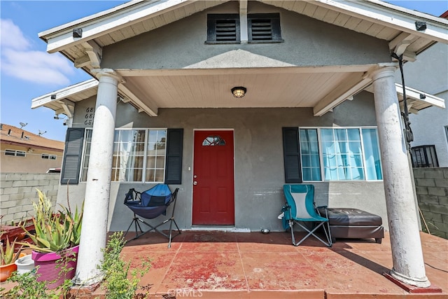 entrance to property with a patio