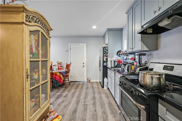 kitchen featuring light hardwood / wood-style flooring, gray cabinetry, and stainless steel appliances