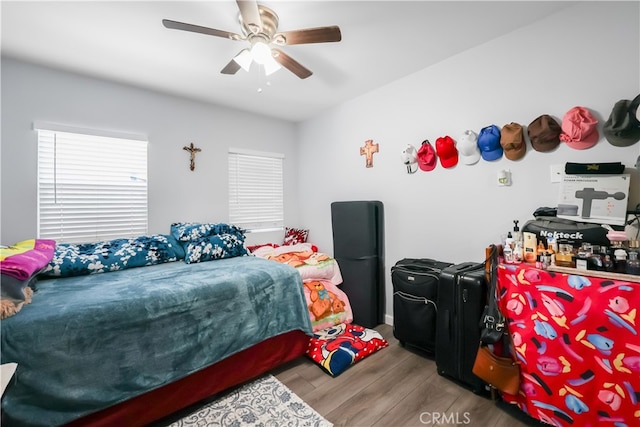 bedroom featuring ceiling fan and hardwood / wood-style flooring