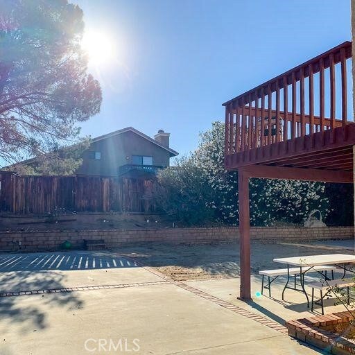 exterior space with a deck and a patio