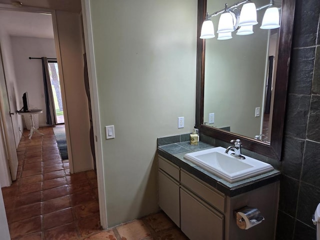 bathroom featuring vanity and an inviting chandelier